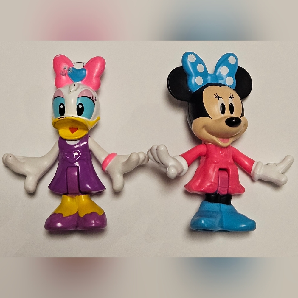 Minnie mouse and daisy duck figures